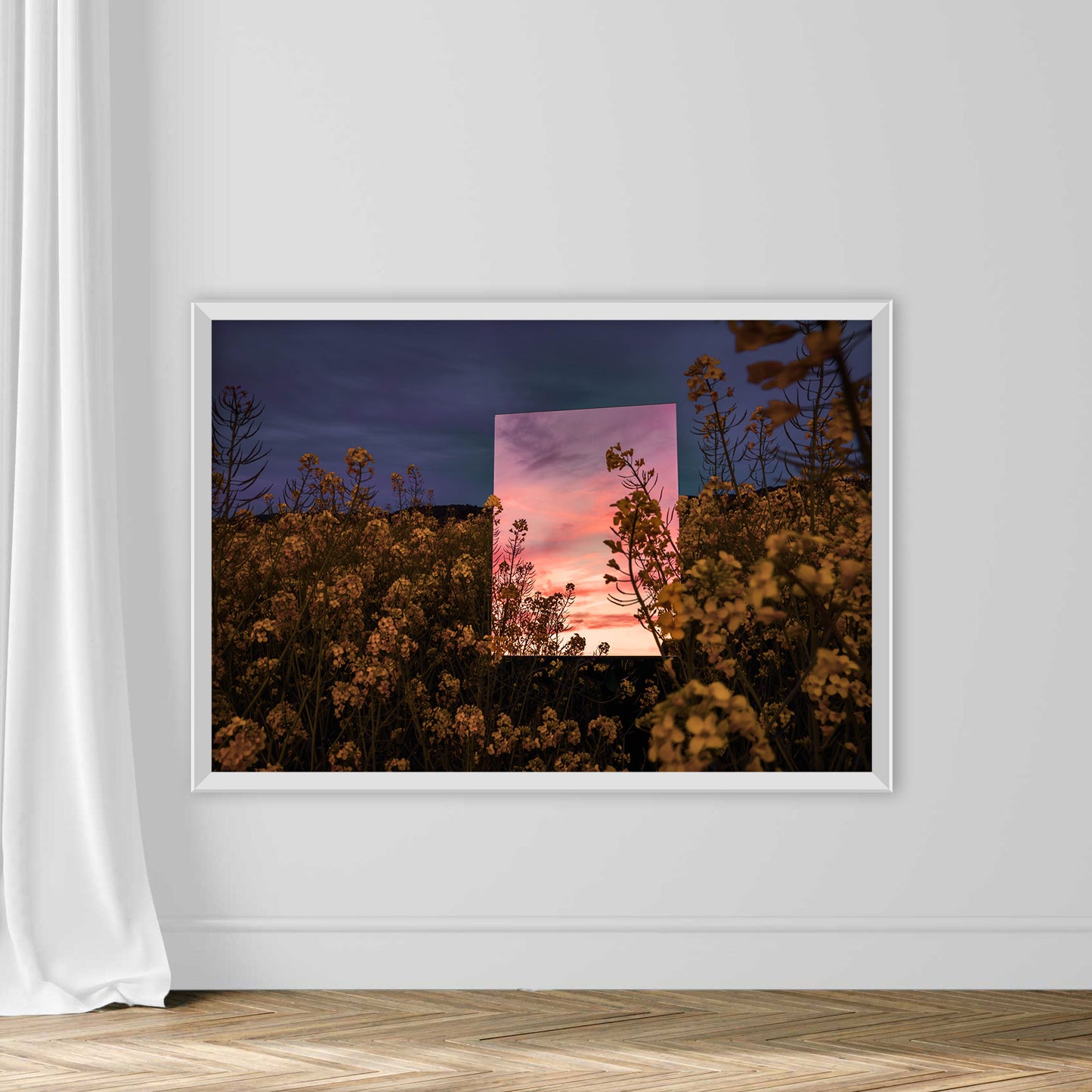 Creative picture of square mirror reflecting dramatic sunset landscape in the nature