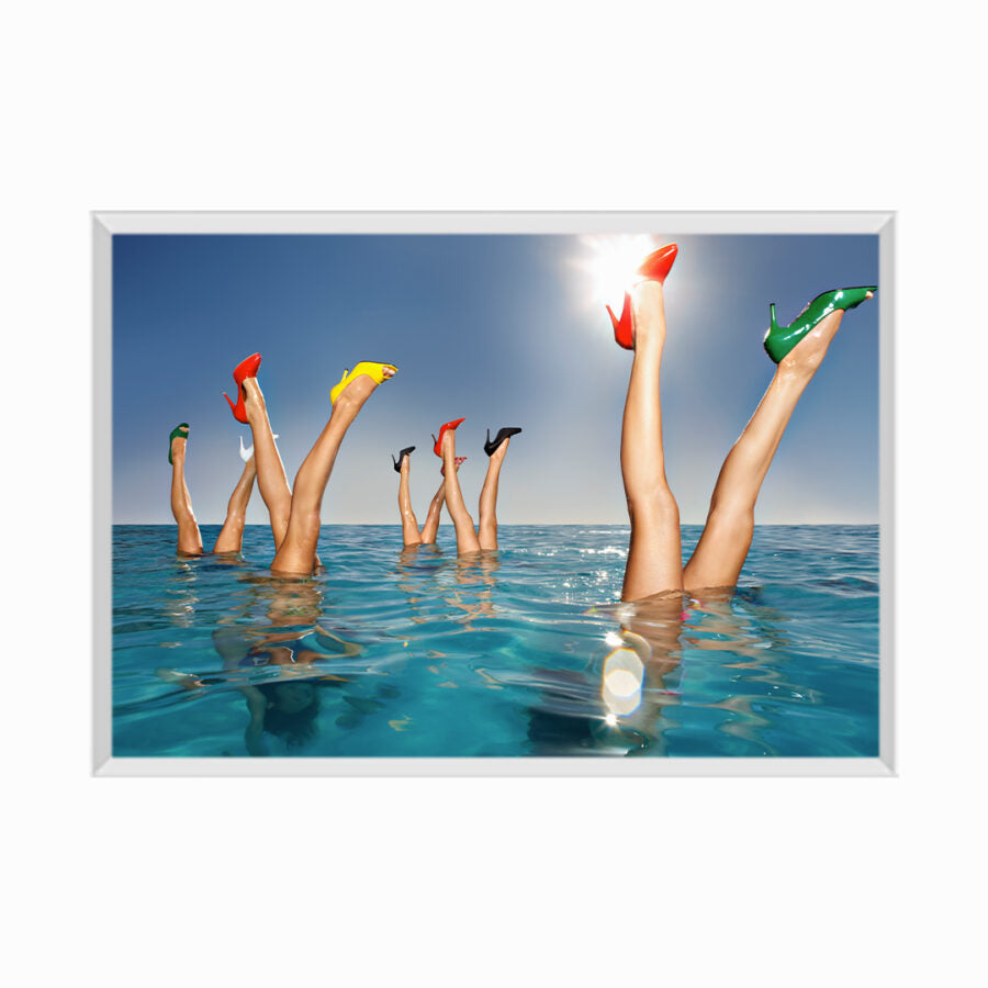 Group of legs protruding out of infinity pool